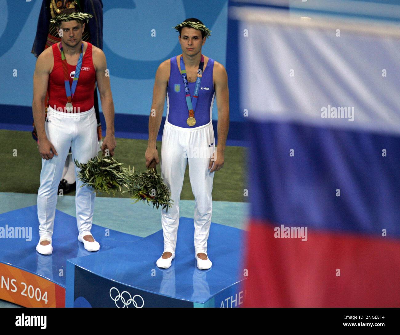 Silver medal winner Alexander Moskalenko of Russia, left, and gold