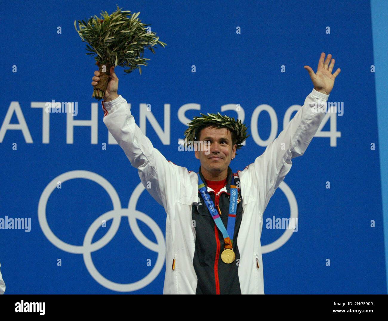 Ralf Schumann from Germany waves after receiving the gold medal for the ...