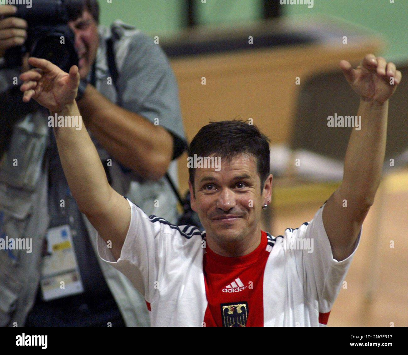 Germany's Ralf Schumann acknowledges the crowd's cheers after winning ...