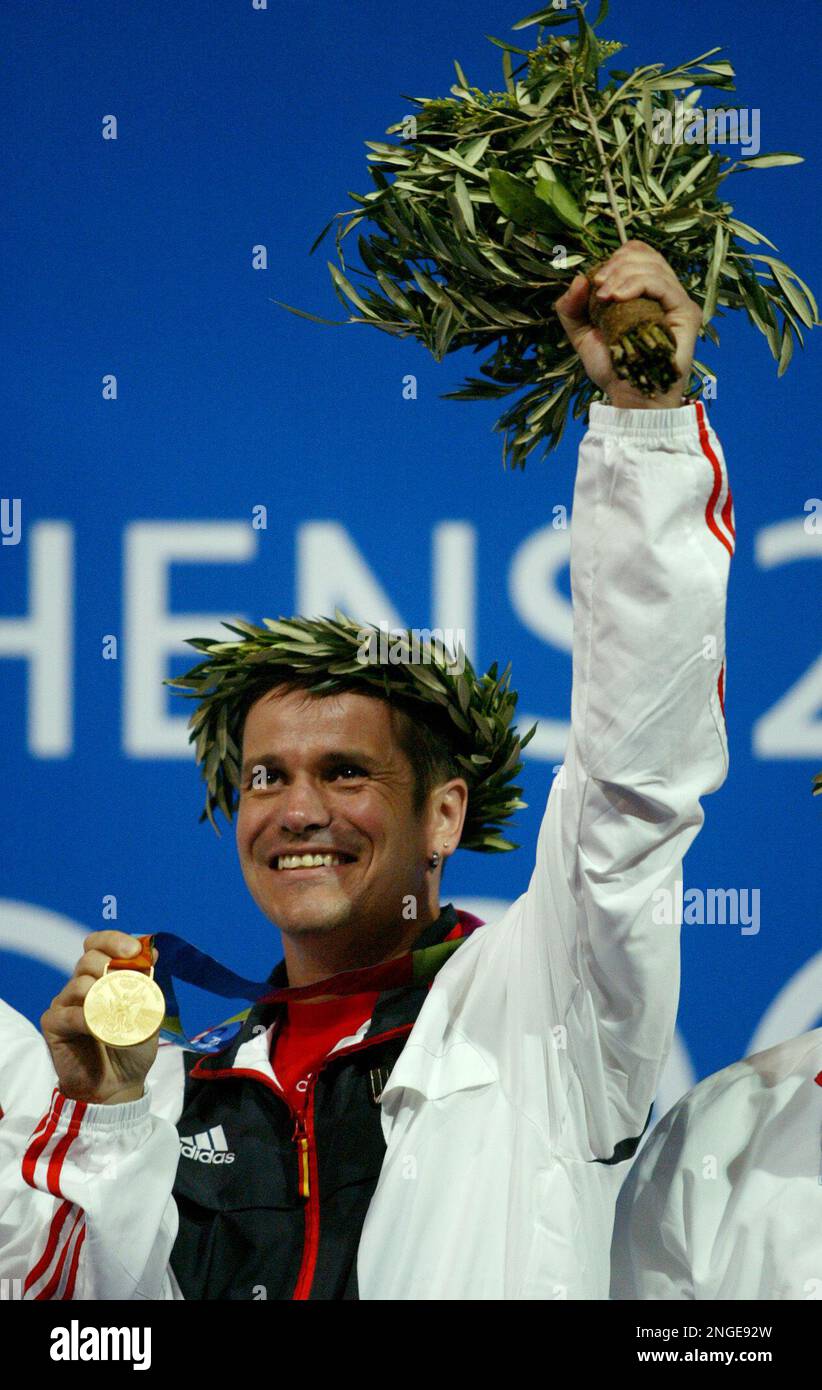 Ralf Schumann, from Germany, waves after receiving the gold medal for ...