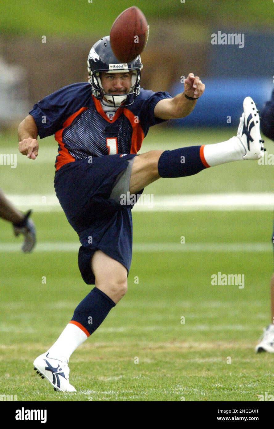 Denver Broncos kicker Jason Elam (1) hops in pain after kicking a