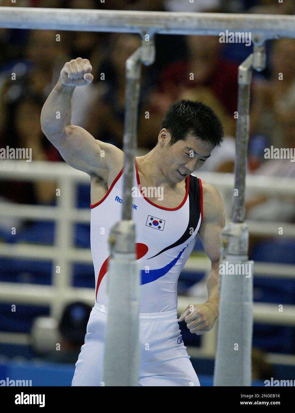 Korea's Yang Tae Young celebrates sticking his dismount from the