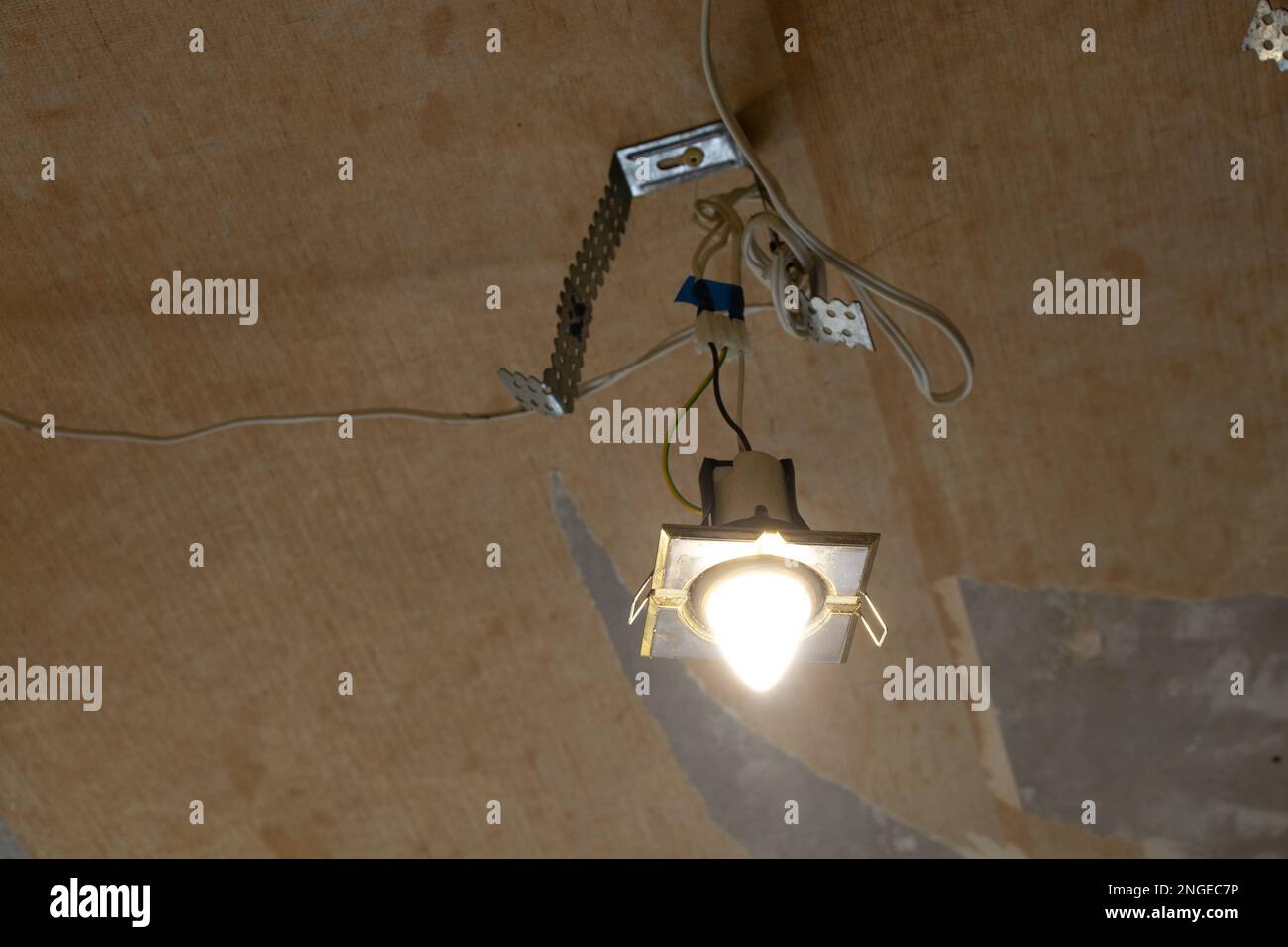 replacement of electric lighting and wires on the ceiling in the apartment, repair Stock Photo