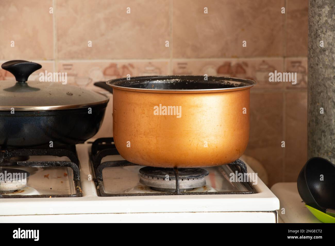 the pan stands on the gas stove in the kitchen in the apartment, cooking Stock Photo Alamy