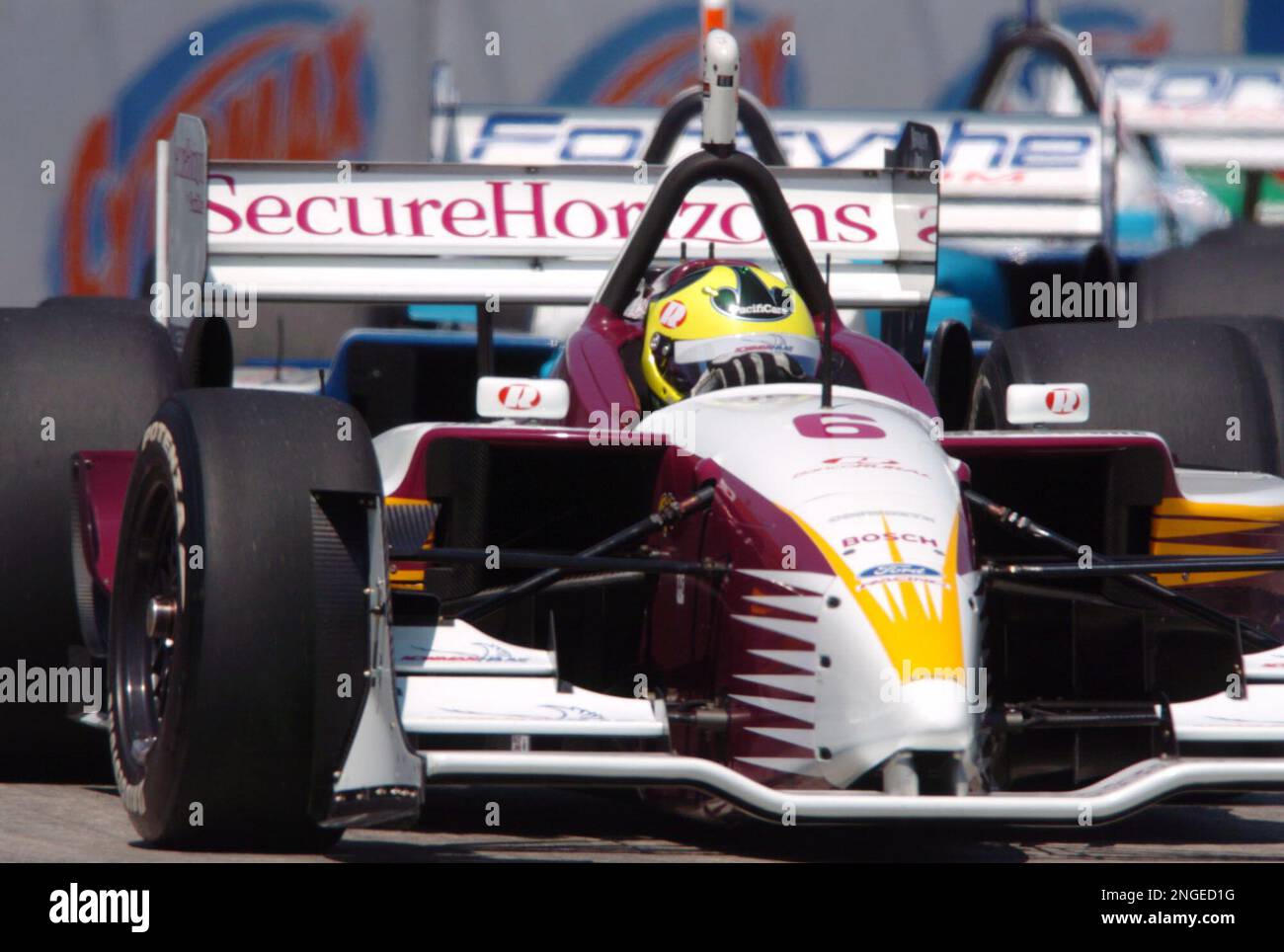 Bruno Junqueira, of Belo Horizonte, Brazil, guides his Ford-Cosworth Lola  for Neman/Haas Racing through the nine turn of the course of the Grand Prix  of Denver with other racers behind him on