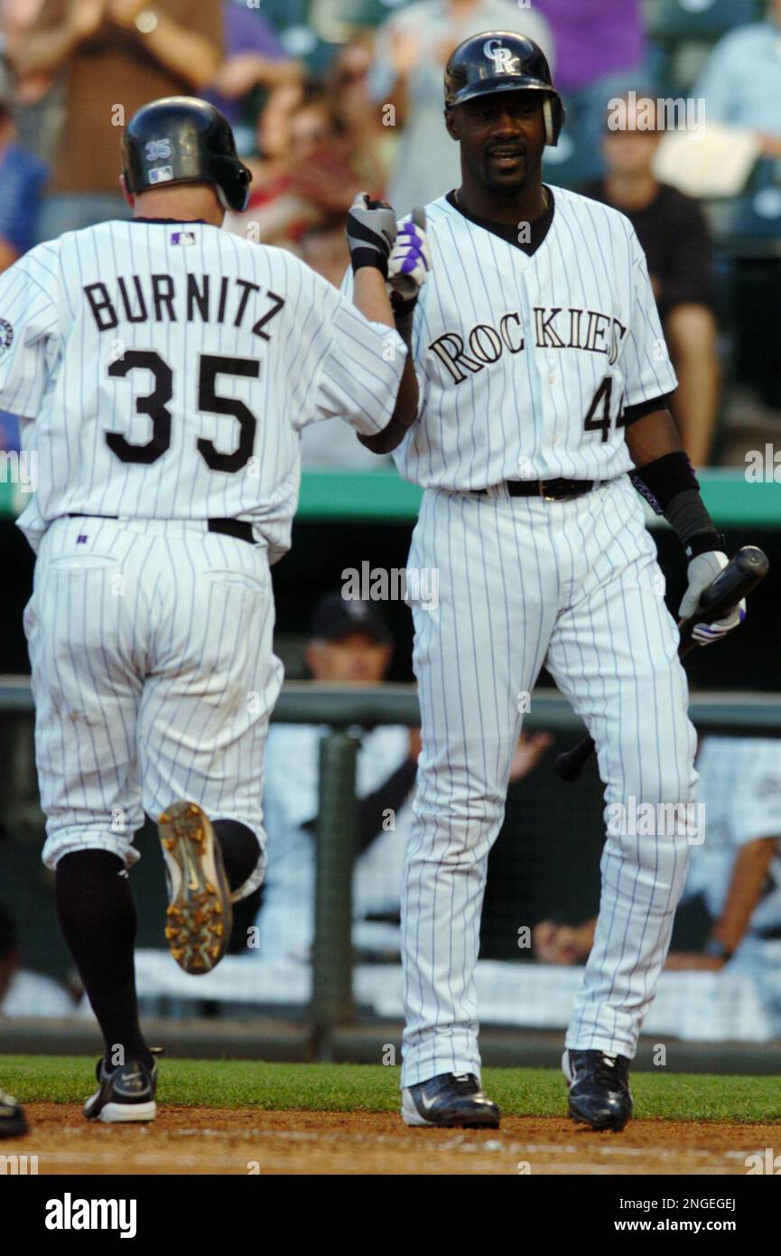 Colorado Rockies' Jeromy Burnitz (35) and Matt Holliday (5) celebrate after  they defeated the Cincinnati Reds, 8-3, Tuesday, May 18, 2004, in  Cincinnati. Burnitz and Holliday hit back-to-back solo home runs in