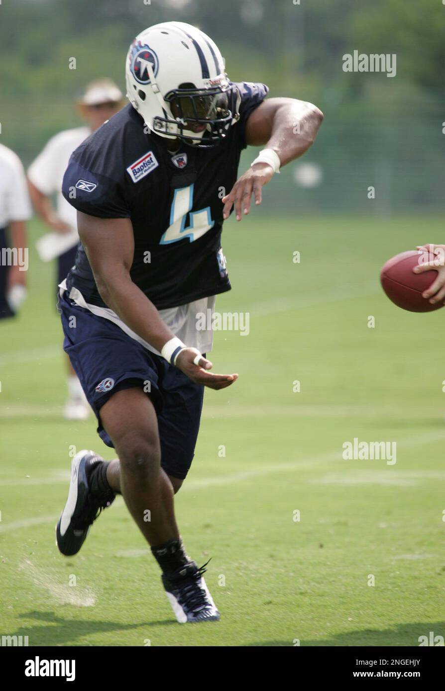 Tennessee Titans running back Jarrett Payton takes a handoff on the first  day of the team's training camp in Nashville, Tenn., Saturday, July 31,  2004. Payton, son of the late Walter Payton,