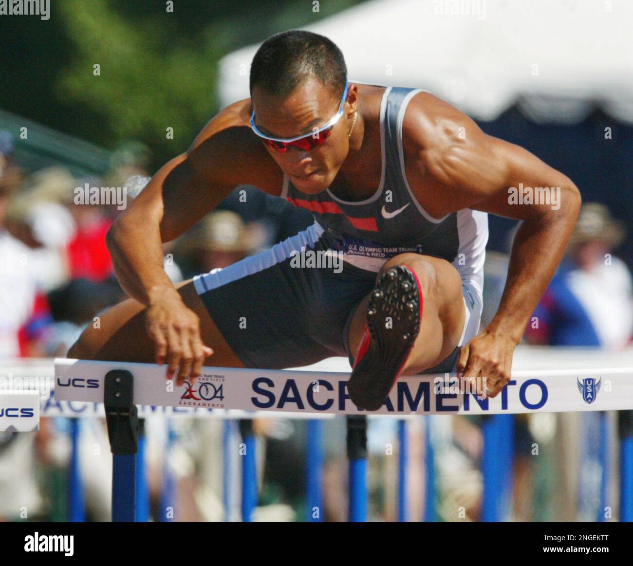 Bryan Clay clears a hurdle during the men's decathlon 110-meter hurdles at  the U.S. Olympic track and field trials in Sacramento, Calif., Saturday,  July 17, 2004. (AP Photo/Rusty Kennedy Stock Photo - Alamy