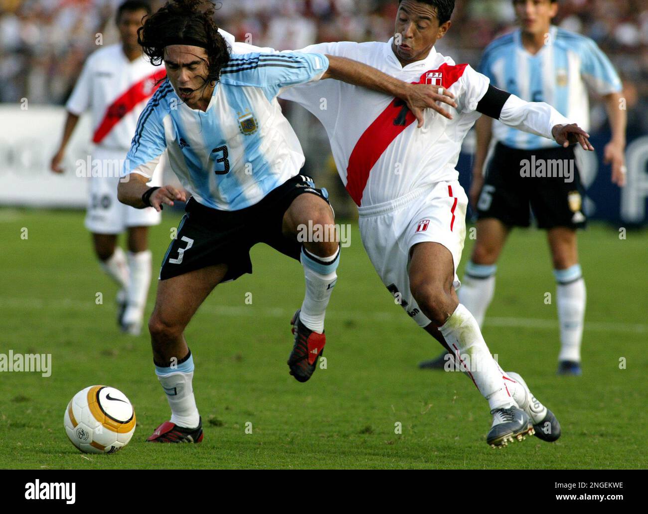 Juan Pablo Sorin of Argentina, fights for the ball with Nolberto Solano of  Peru, during their quarterfinals game of the Copa America, in Chiclayo,  Peru, Saturday, July 17, 2004. (AP Photo/Ricardo Mazalan
