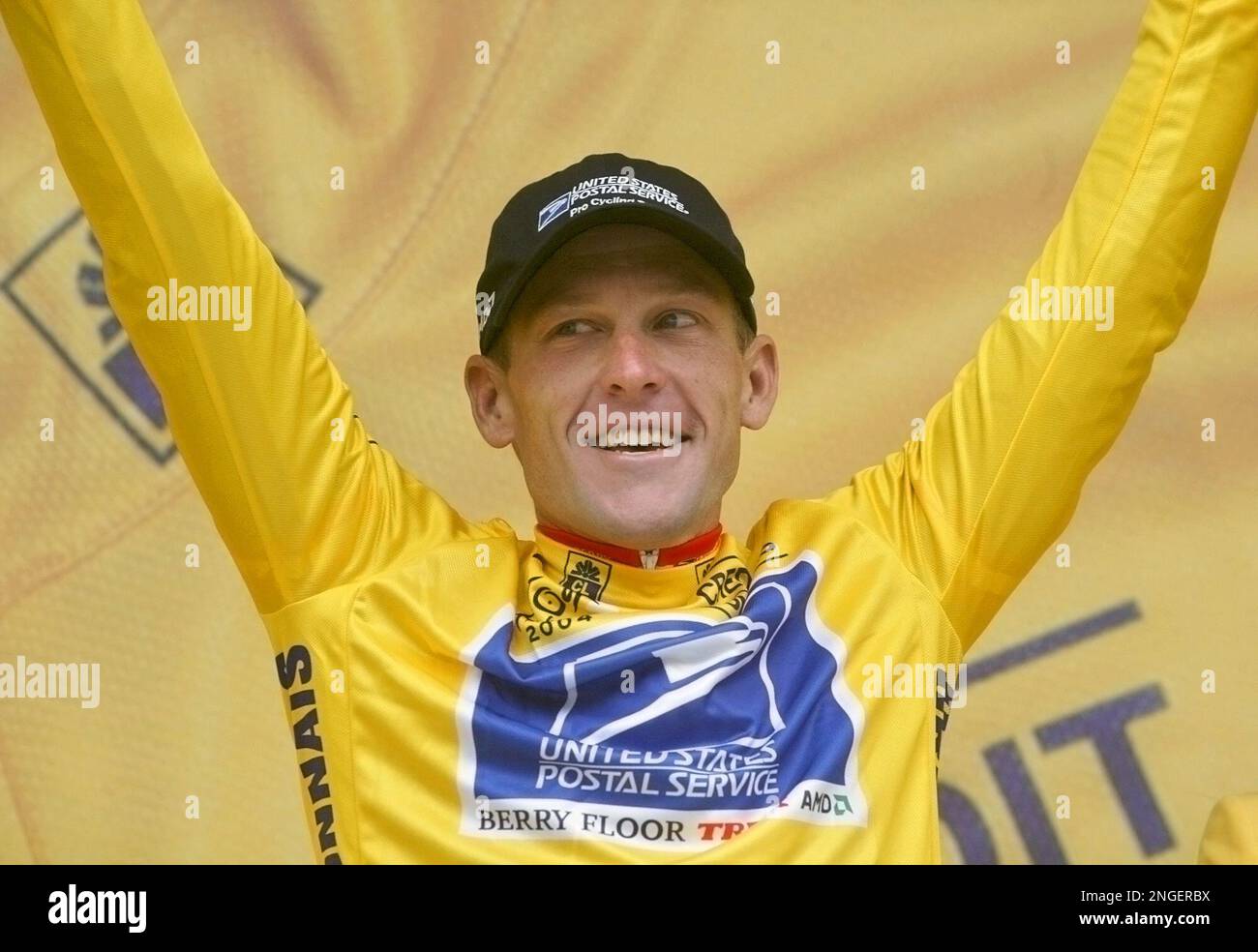 New overall leader Lance Armstrong, of Austin, Texas, wearing the yellow  jersey, waves from the podium after the 4th stage of the Tour de France  cycling race, a 64.5-kilometer (40.08-mile) team time-trial