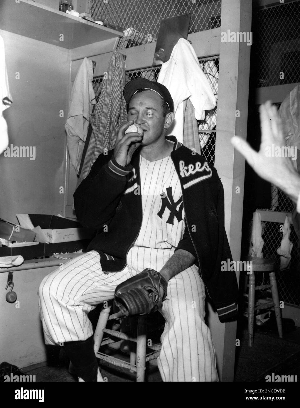 Allie Reynolds of the New York Yankees kisses the ball after pitching a