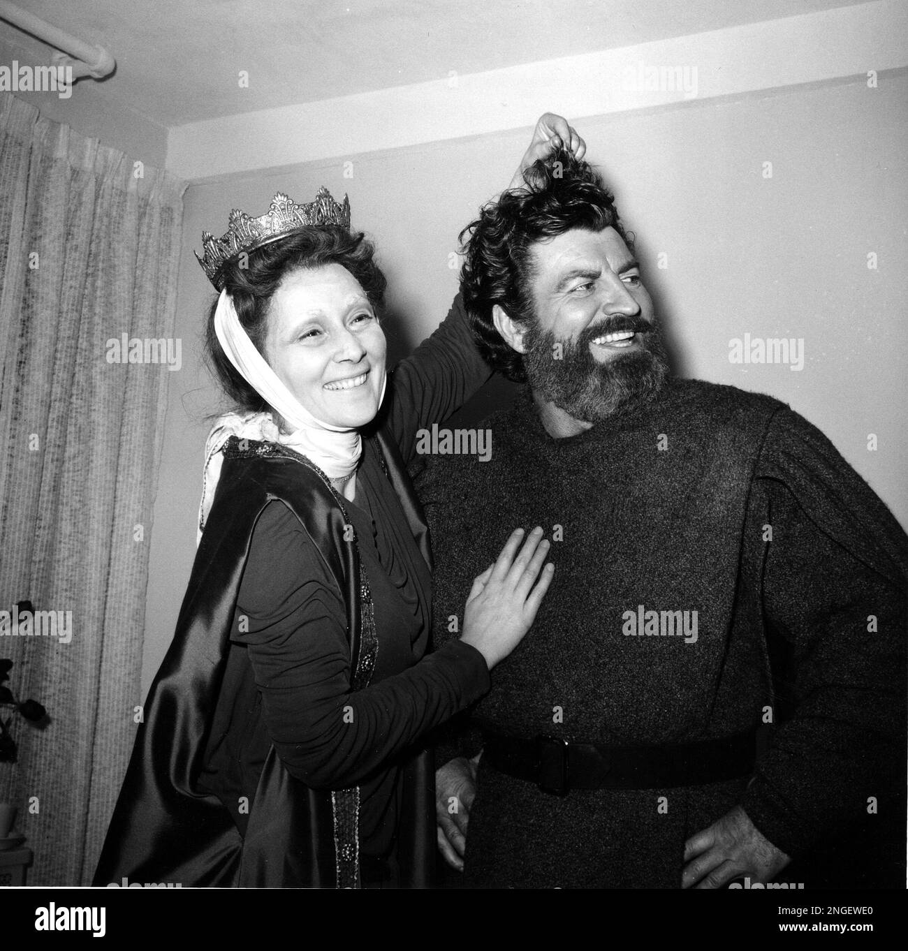 Actress Rosemary Harris, shows that the hair on costar Robert Preston