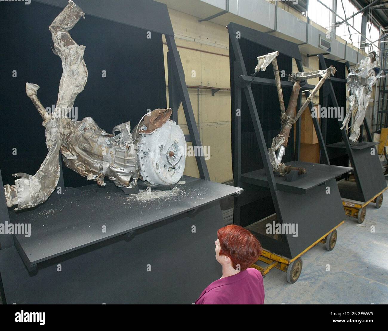 A visitor looks at the wreckage of the turbo-compressor of famed ...