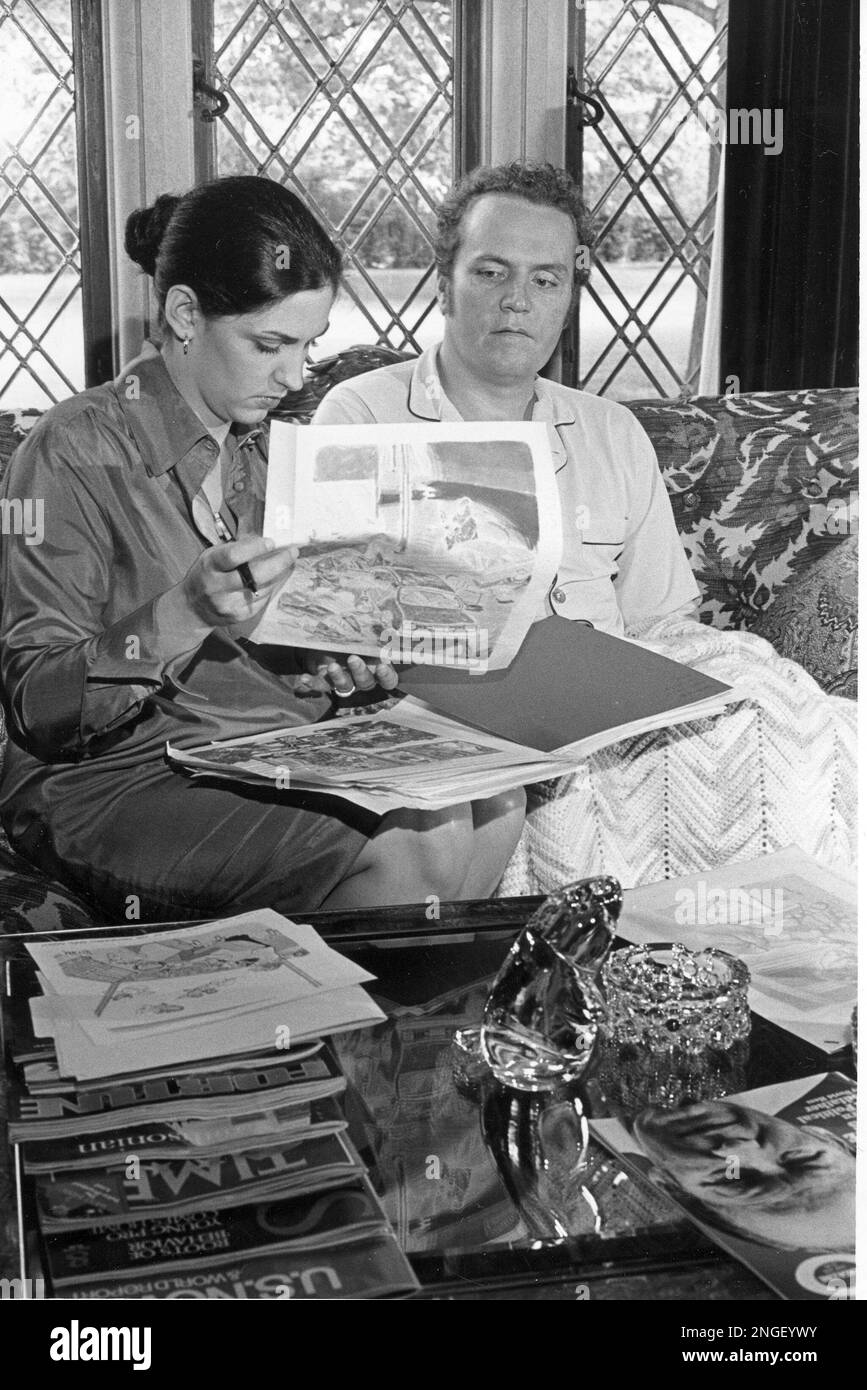 Magazine publisher Larry Flynt and his wife, Althea, review cartoons drawn for his Hustler magazine prior to a taped NBC-TV "Today" show interview in their suburban home in Columbus, Ohio, June 21, 1978. (AP Photo) Stock Photo