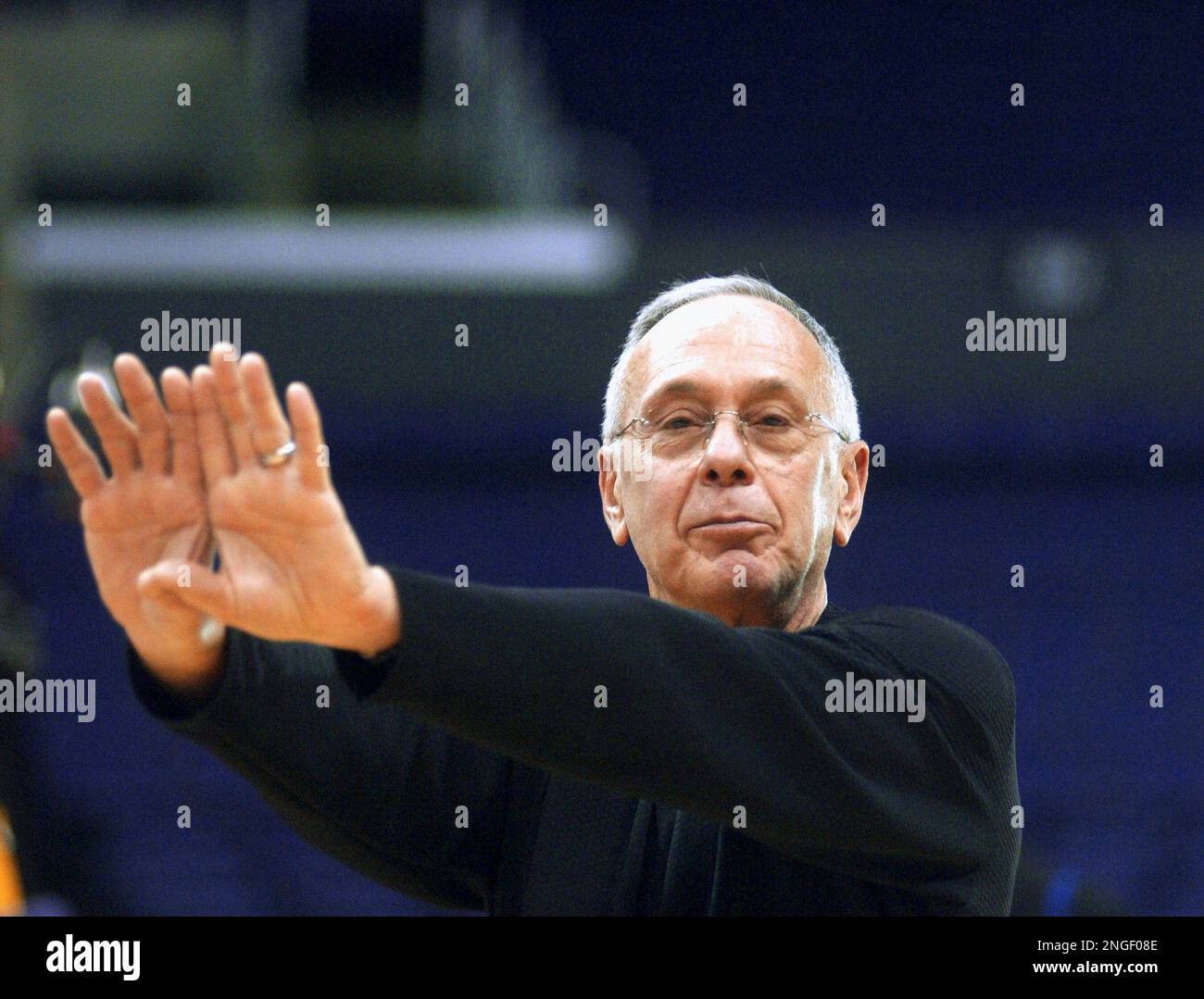 Detroit Pistons coach Larry Brown stretches Monday, June 7, 2004, before a team practice at the
