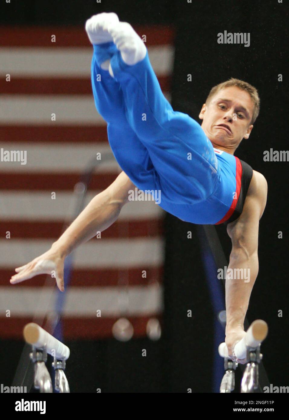 Alexander Artemev performs on the parallel bars at the U.S. Gymnastics