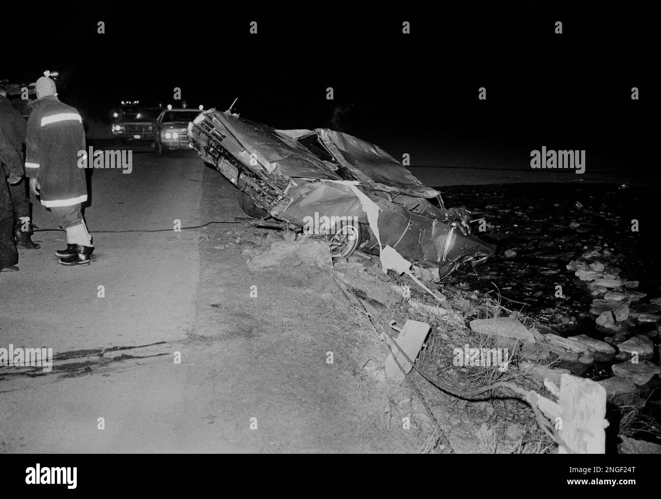 Wreckage of a car is pulled from an icy lake in Tarrytown, N.Y., after