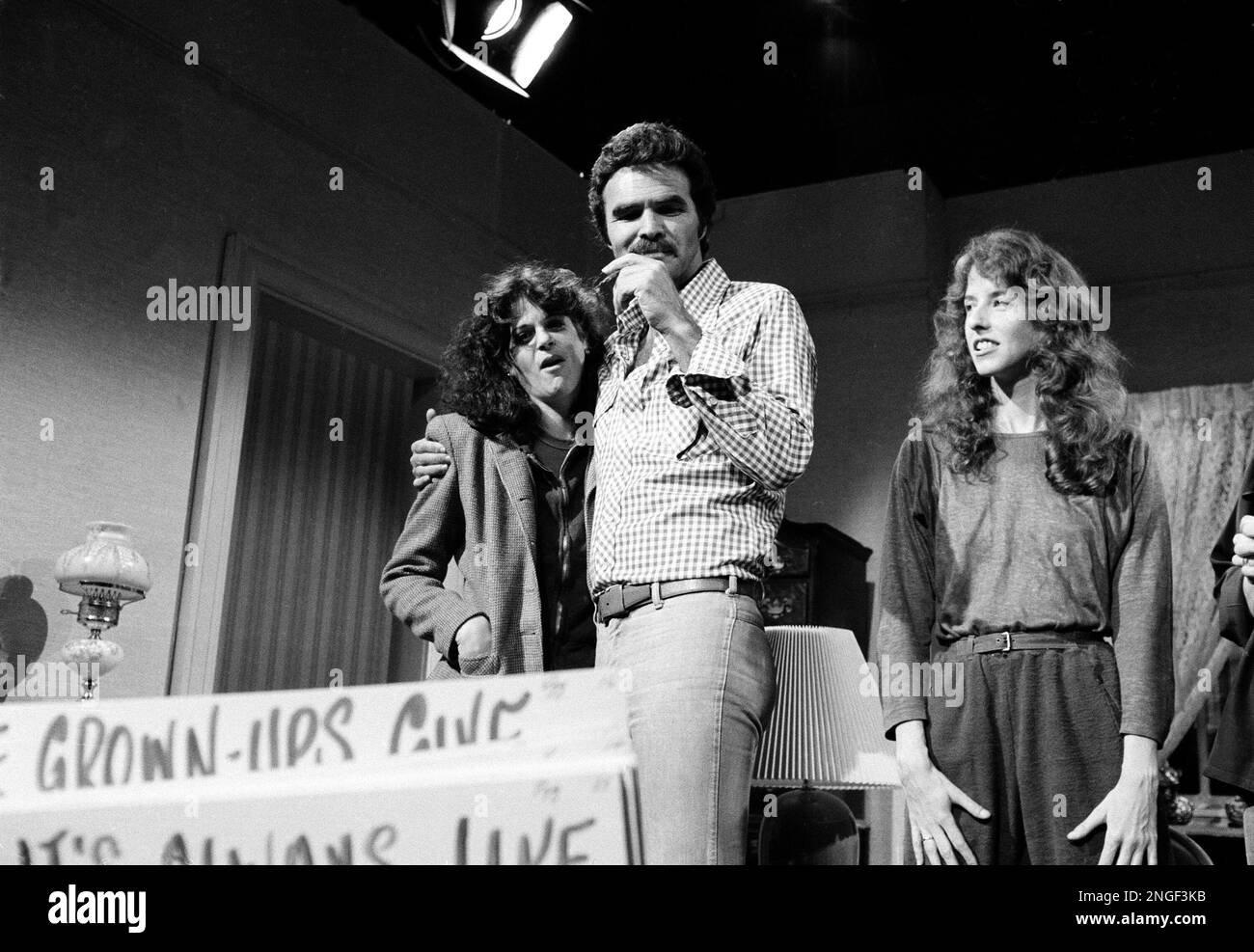 "Saturday Night Live" guest host actor Burt Reynolds, center, looks at