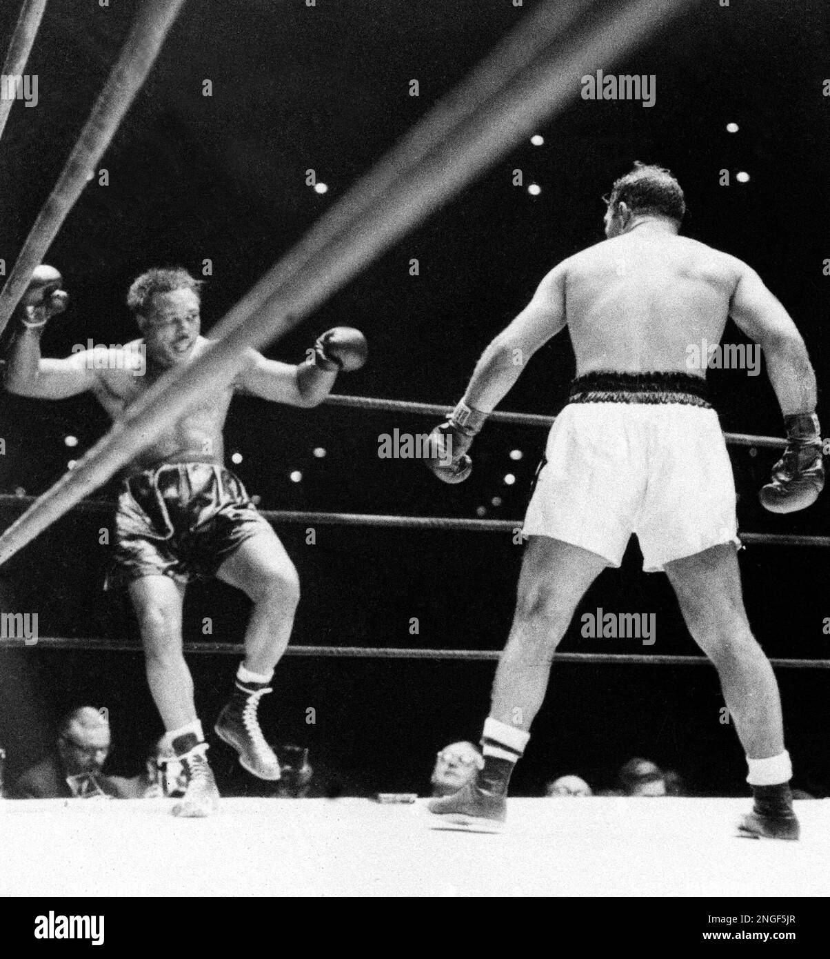 https://c8.alamy.com/comp/2NGF5JR/defending-heavyweight-champion-rocky-marciano-in-white-trunks-watches-as-challenger-archie-moore-goes-down-after-being-knocked-out-with-a-right-and-left-in-the-ninth-round-of-their-world-title-bout-at-yankee-stadium-in-the-bronx-new-york-city-september-21-1955-ap-photo-2NGF5JR.jpg