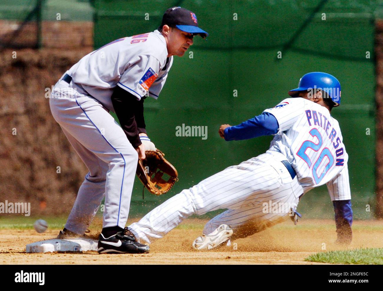 Chicago Cubs' Corey Patterson steals second as the ball gets past New York  Mets second baseman Joe McEwing, left, during the first inning Friday,  April 23, 2004 in Chicago. Patterson went on