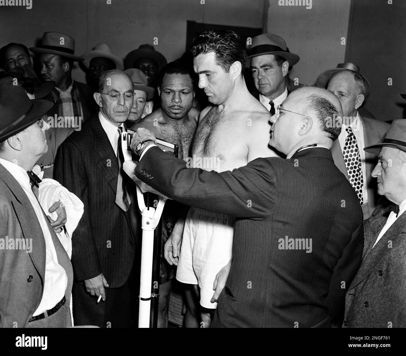Light heavyweight champion Joey Maxim is weighed in for