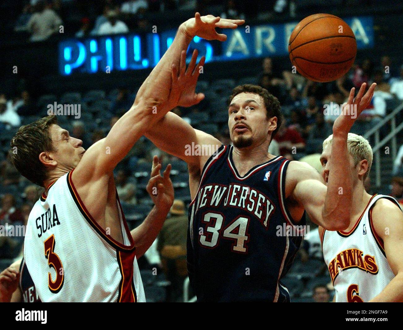 Atlanta Hawks guard Bob Sura 3 battles for a rebound against New Jersey Nets center Aaron Williams 34 during the fourth quarter Monday April 12 2004 at Philips Arena in Atlanta. Sura