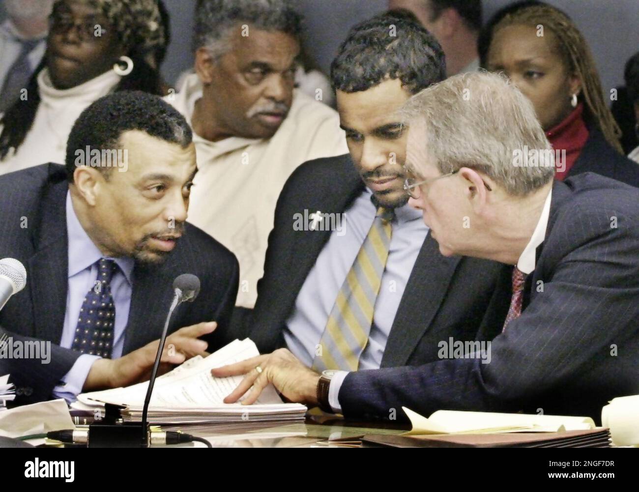 Jayson Williams defense team members, from left, attorney Billy Martin,  spokeswoman Judy Smith and attorney Joseph A. Hayden Jr. walk arm in arm  from the Somerset County Courthouse in Somerville, N.J., following