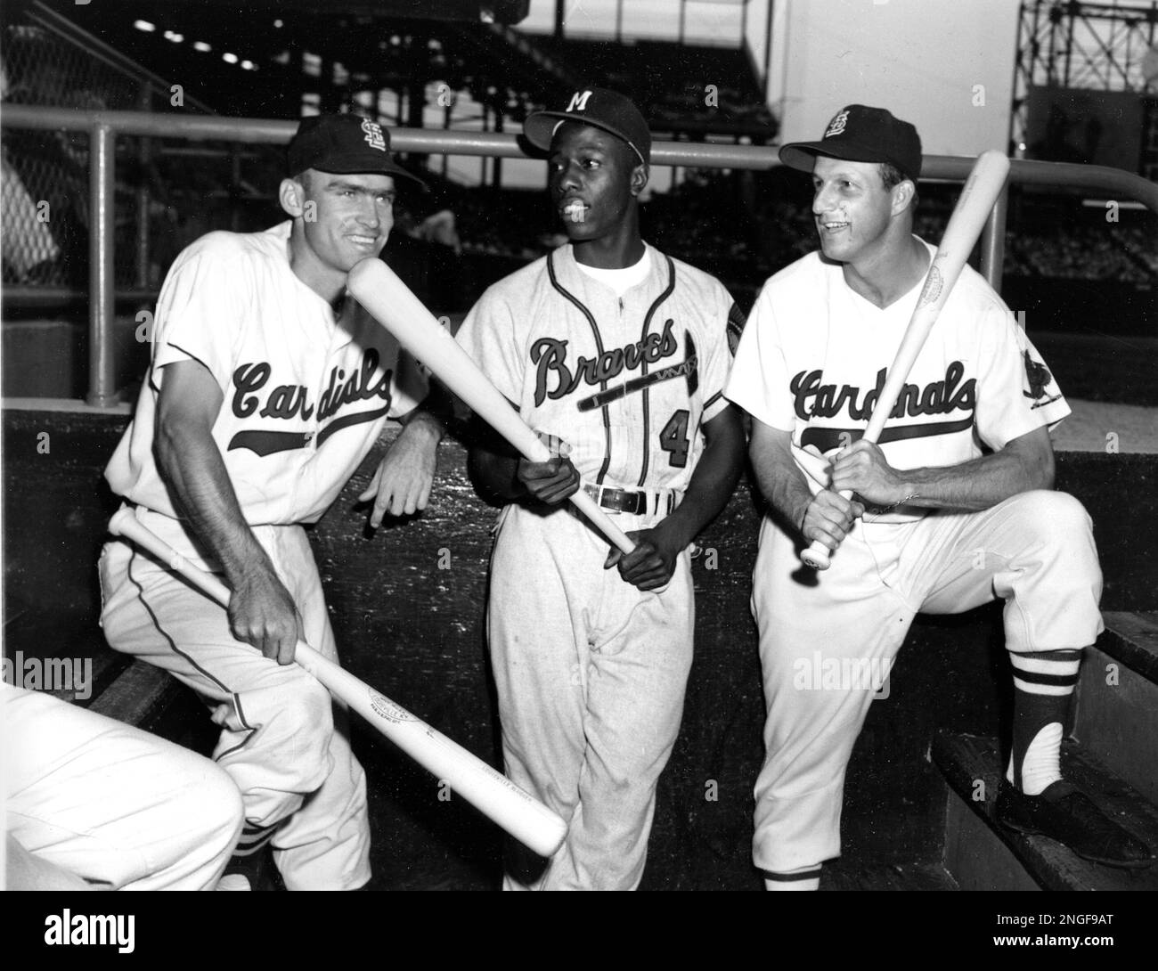 Milwaukee Braves outfielder Hank Aaron, center, jokes with St. Louis  Cardinals players Wally Moon, left, and Stan Musial before start of game  between the Cardinals and the Braves at Busch Stadium in