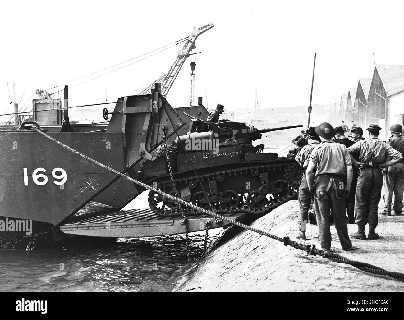 A Light Tank Is Landed At The Port Of Arzew Algeria As Allied North a-light-tank-is-landed-at-the-port-of-arzew-algeria-as-allied-north