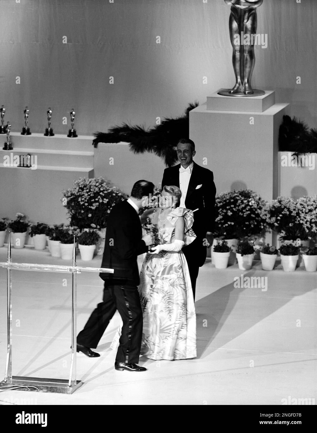 Actress Clare Trevor presents Karl Malden with the best supporting ...