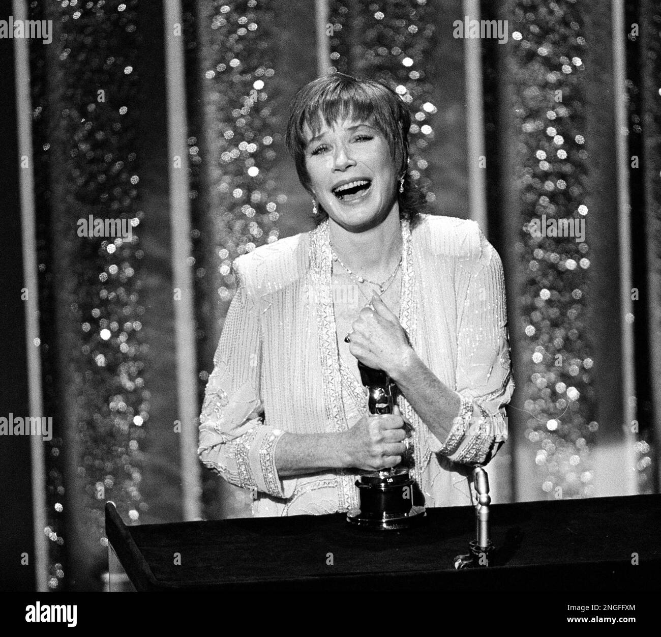 Actress Shirley MacLaine accepts her Oscar at the 56th annual Academy