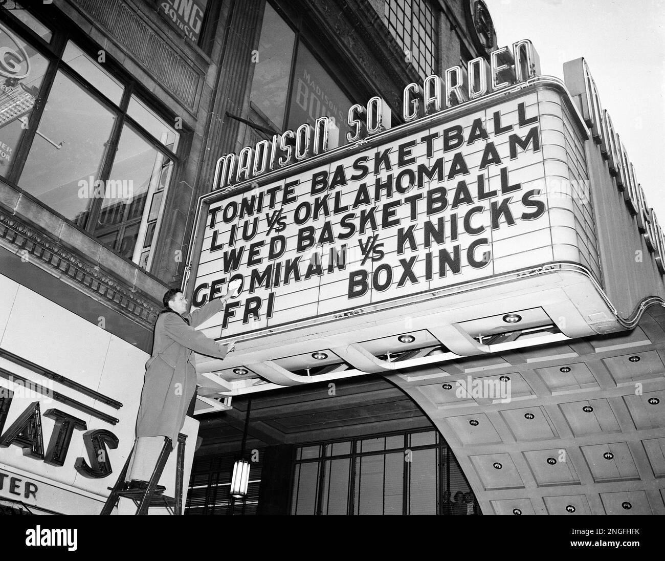 george-mikan-of-the-minneapolis-lakers-polishes-his-name-at-the-marquee-at-madison-square-garden-in-new-york-on-december-13-1949-ap-photojacob-harris-2NGFHFK.jpg
