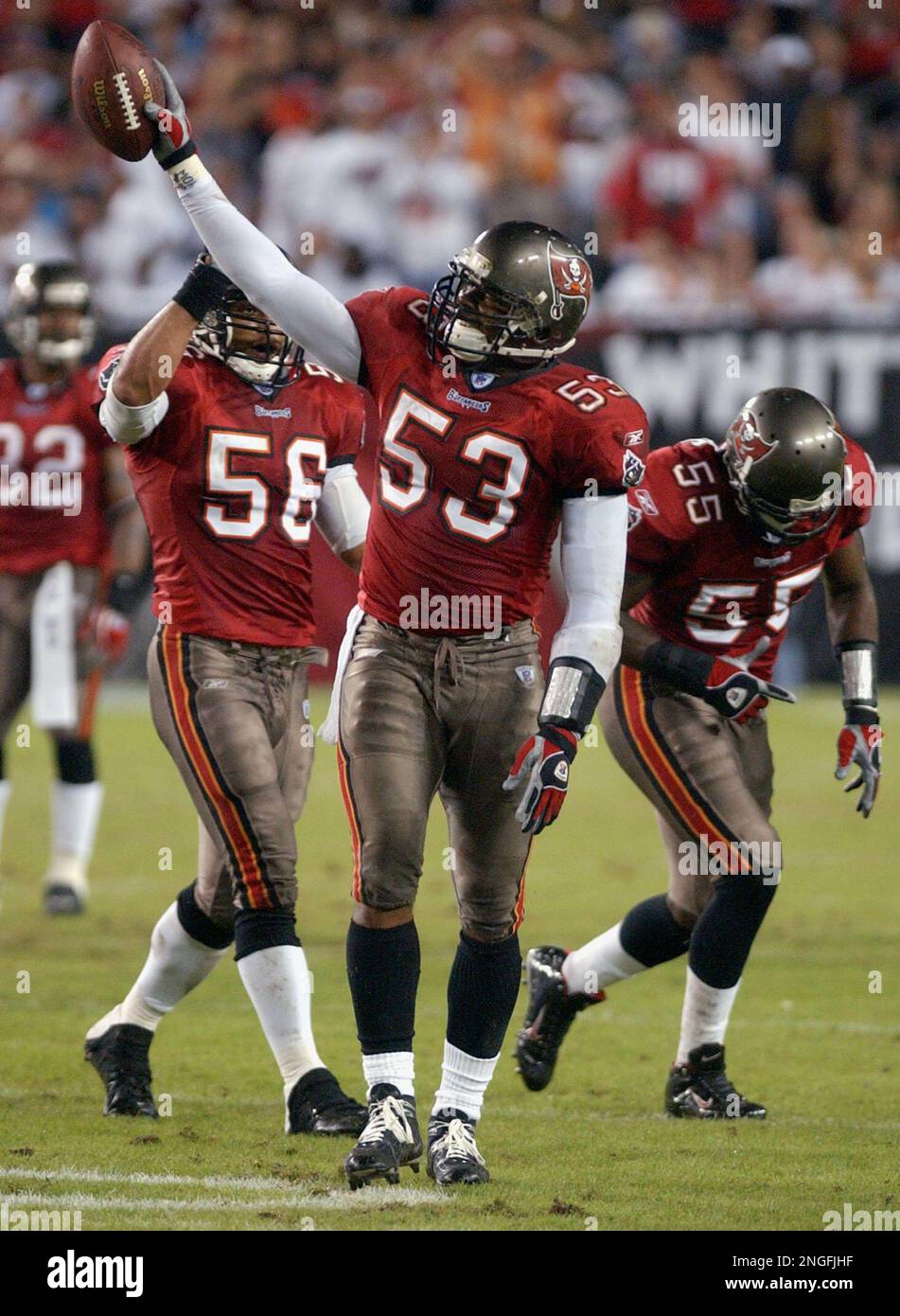 Tampa Bay Buccaneers' linebacker Shelton Quarles (53) tackles Seattle  Seahawks' running back Shaun Alexander as Seahawks' tight end Jerramy  Stevens (86) blocks Buccaneers' defensive end Greg Spires (94) at Raymond  James Stadium