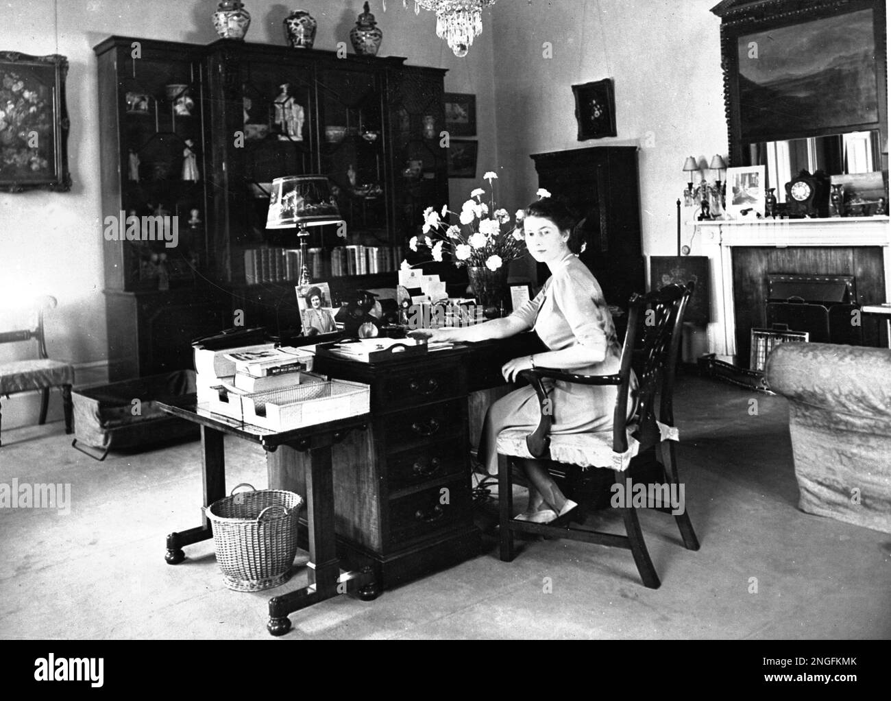 Britain's Princess Elizabeth, later Queen Elizabeth II, sits at her ...