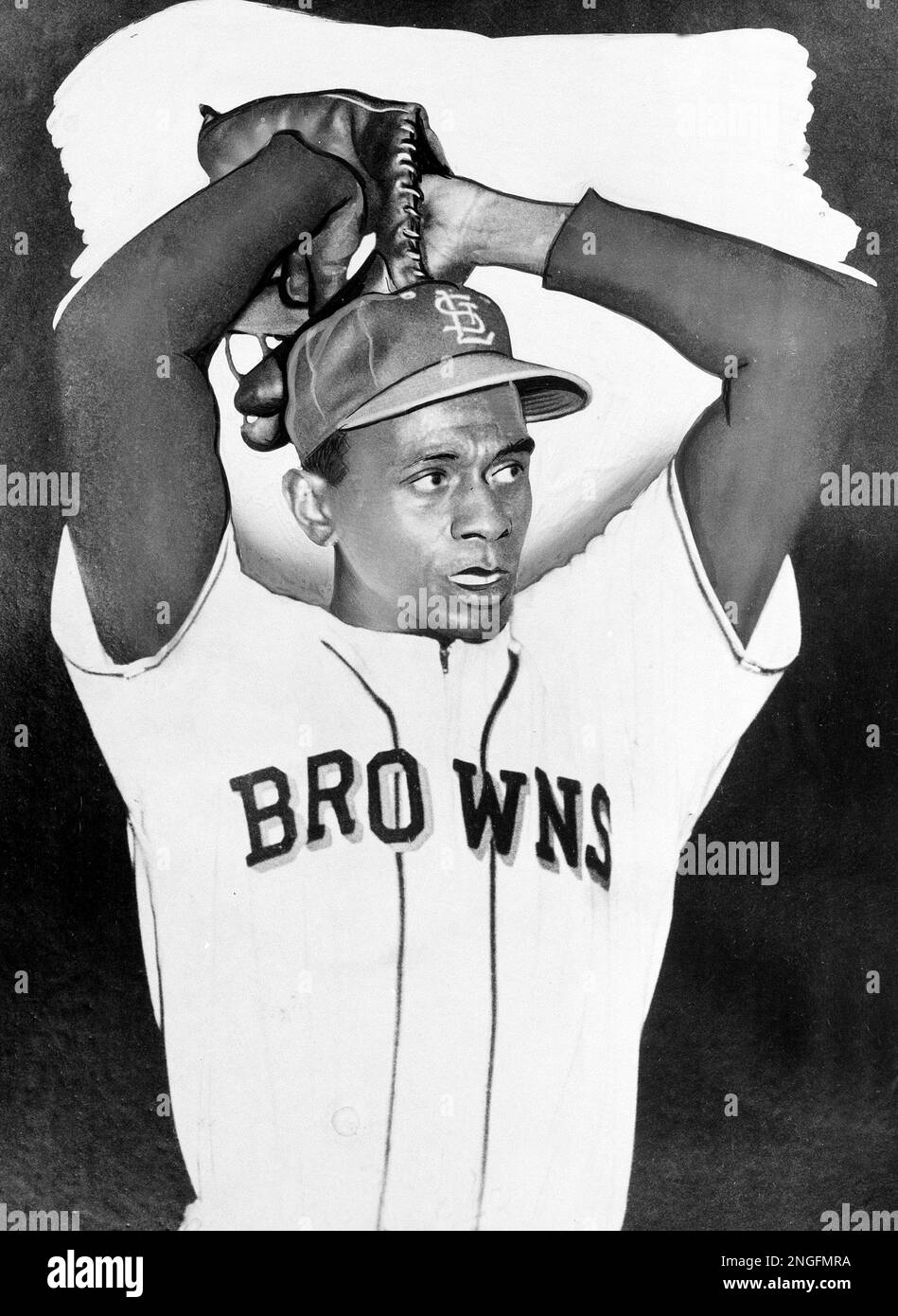 Satchel Paige, the ageless right-handed pitching star, returns to major  league baseball starting for the Browns in St. Louis, on July 19, 1951.  Here he is seen warming up prior to a