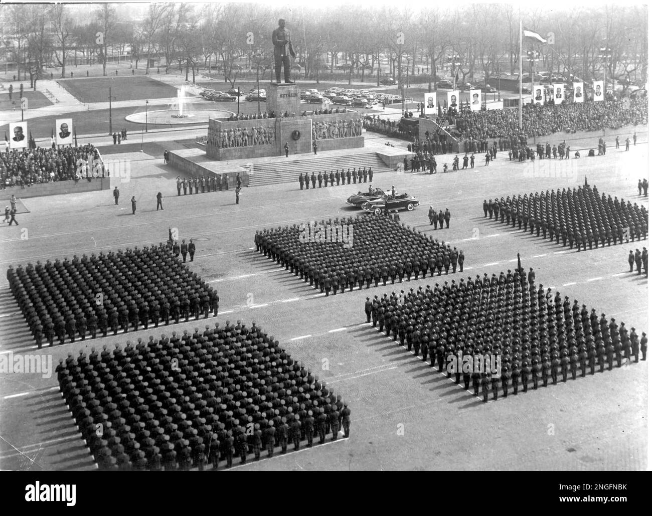 A statue of Stalin is the centerpiece as ranks of Hungarian soldiers