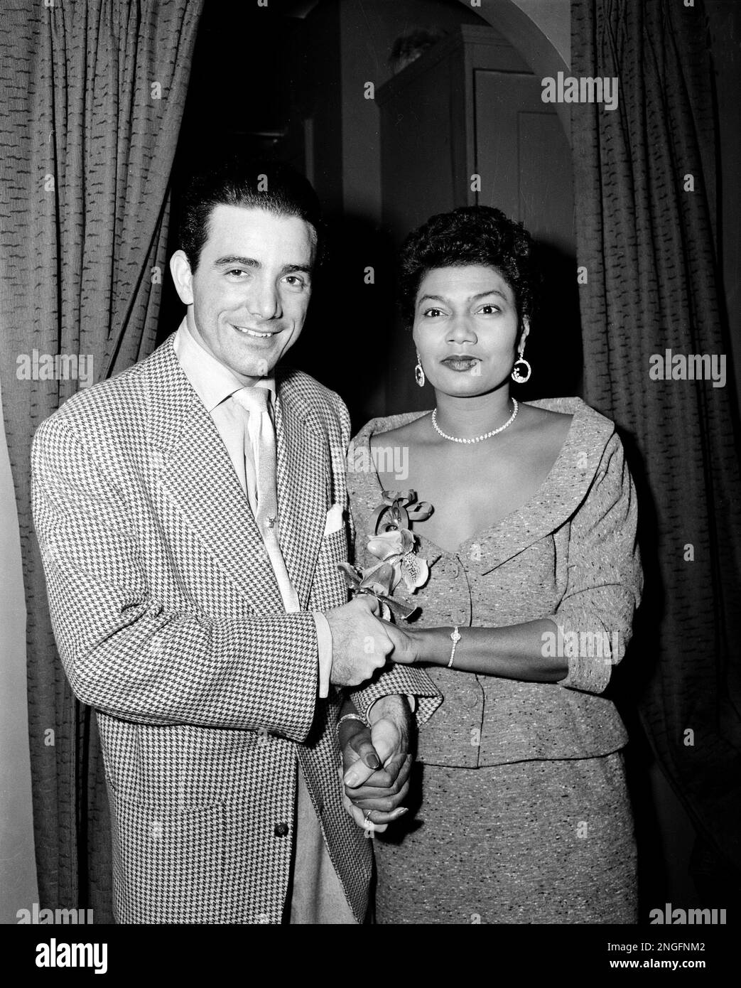Actresssinger Pearl Bailey poses with her husband, drummer and musical