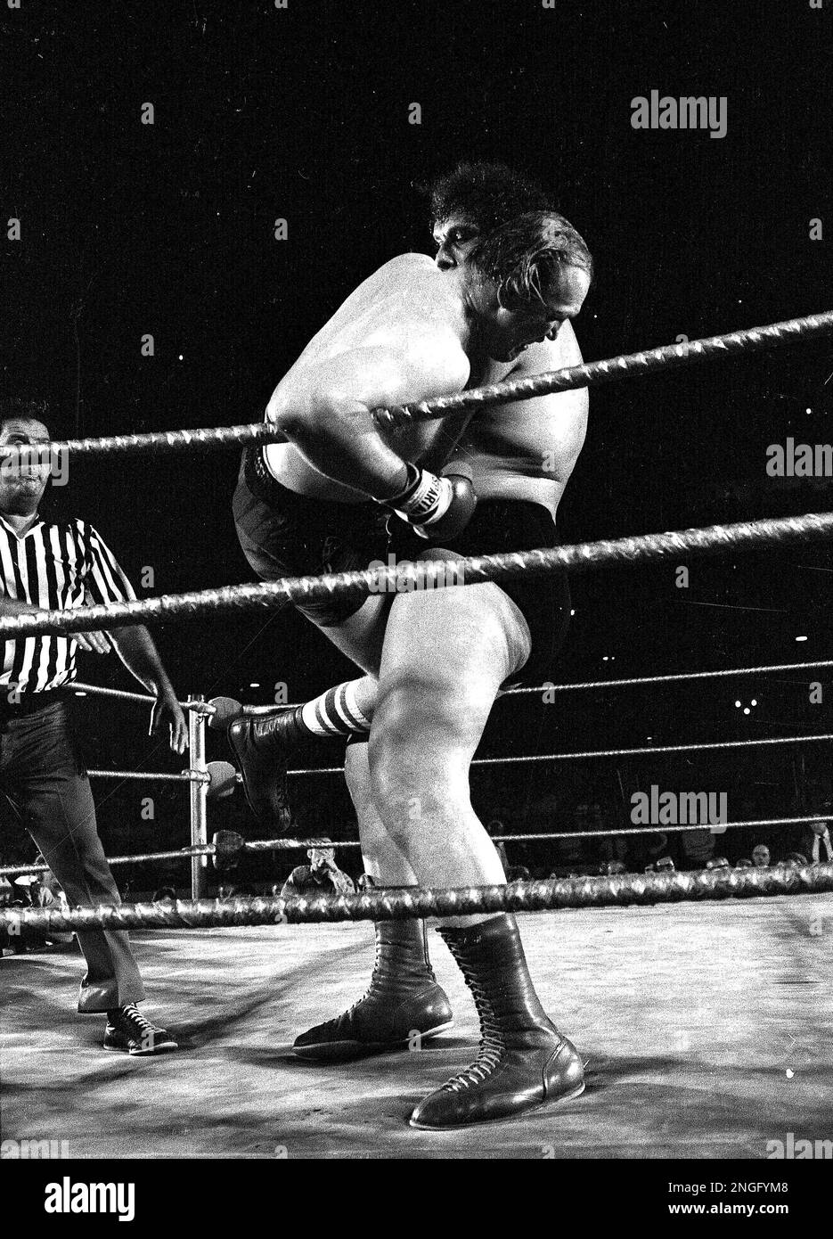 Professional wrestler Andre the Giant tosses heavyweight contender