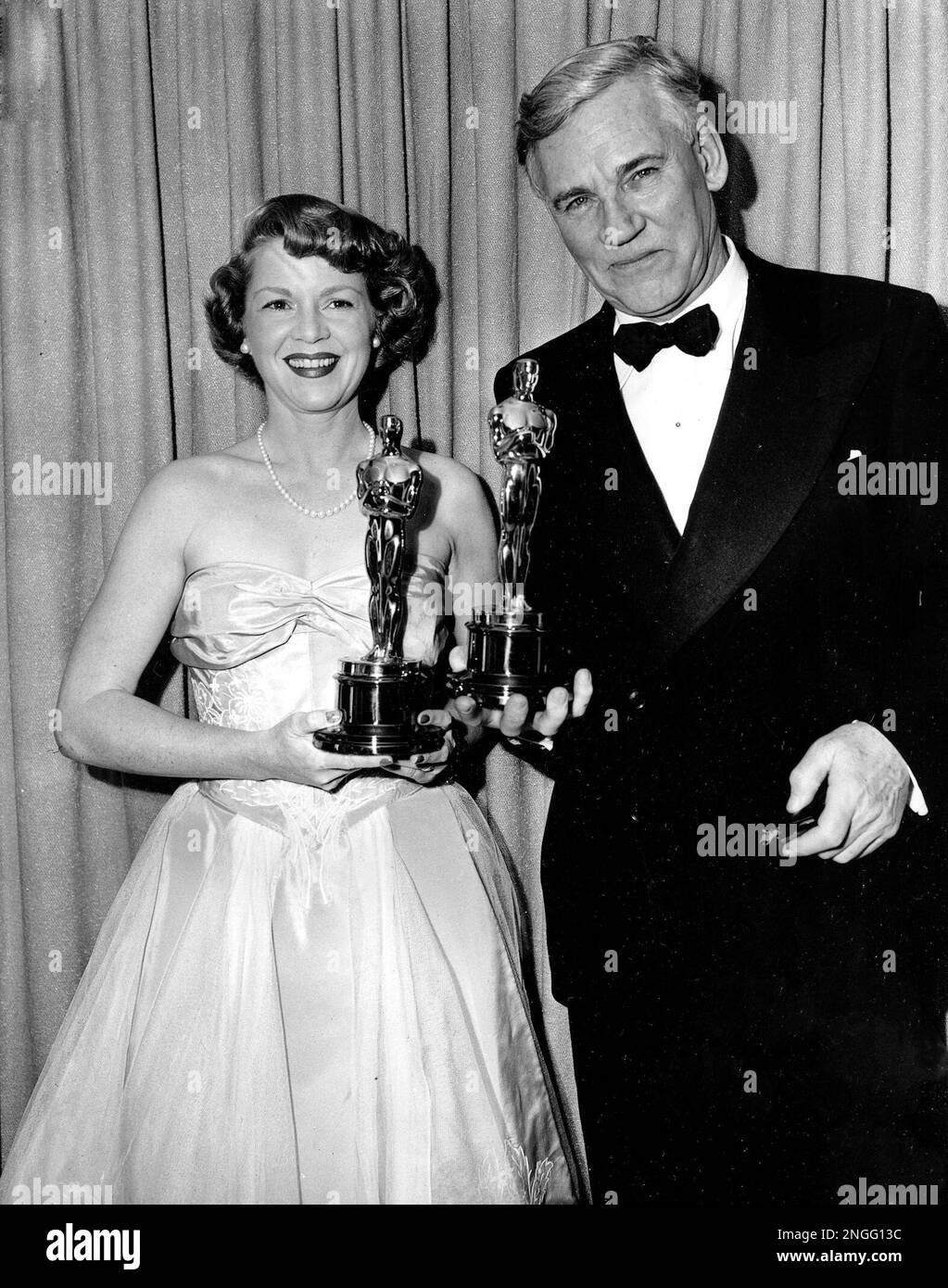 Actress Clair Trevor and Walter Huston pose with their Oscars at the ...