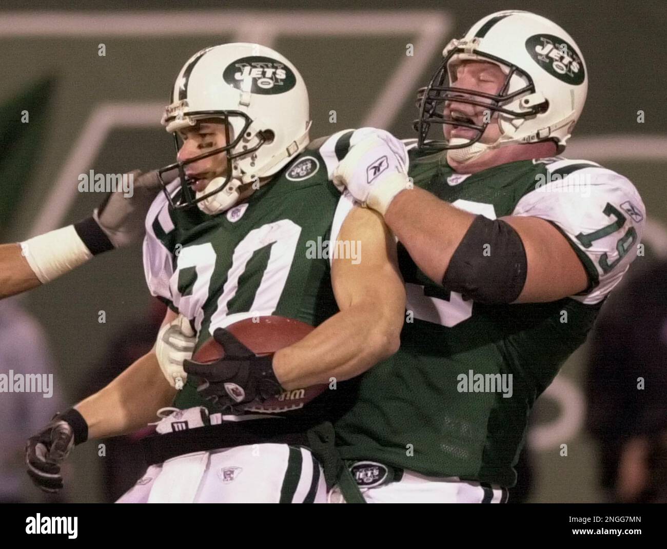 New York Jets receiver Wayne Chrebet,left, is congratulated by teammate  Dave Szott after scoring a second quarter touchdown against the Green Bay  Packers at Giants Stadium Sunday, Dec. 29, 2002, in East