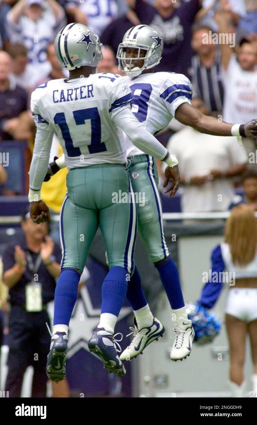 Quarterback Quincy Carter, of the Dallas Cowboys, drops back with a fake  hand off, before throwing theball down field, in the 1st quarter, as the Dallas  Cowboys face the New England Patriots