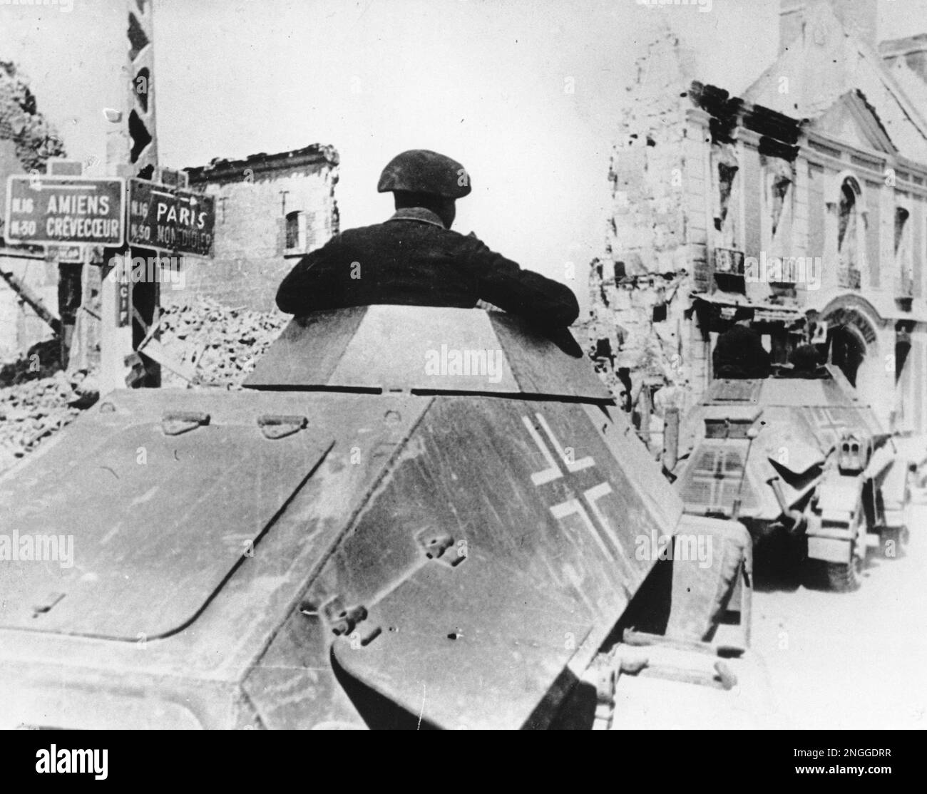 Armored reconnaissance vehicles of the invading German army are seen as ...