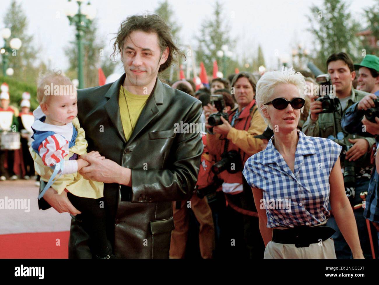 British pop singer Bob Geldof holds his baby as he and his wife, Paula