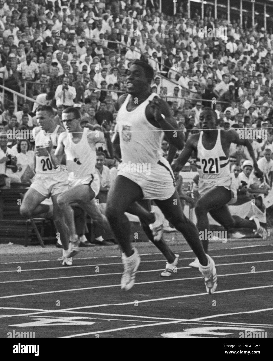 Bob Hayes, of Florida A&M, crosses the finish line to win the 100meter dash in a world record