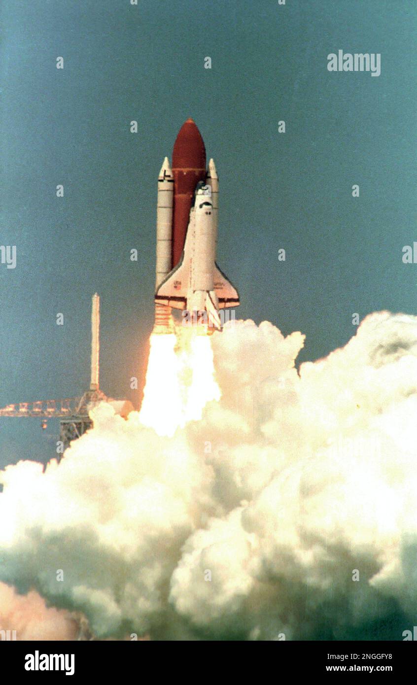U.S. Space Shuttle orbiter Atlantis lifts off from Pad 39-B through a ...