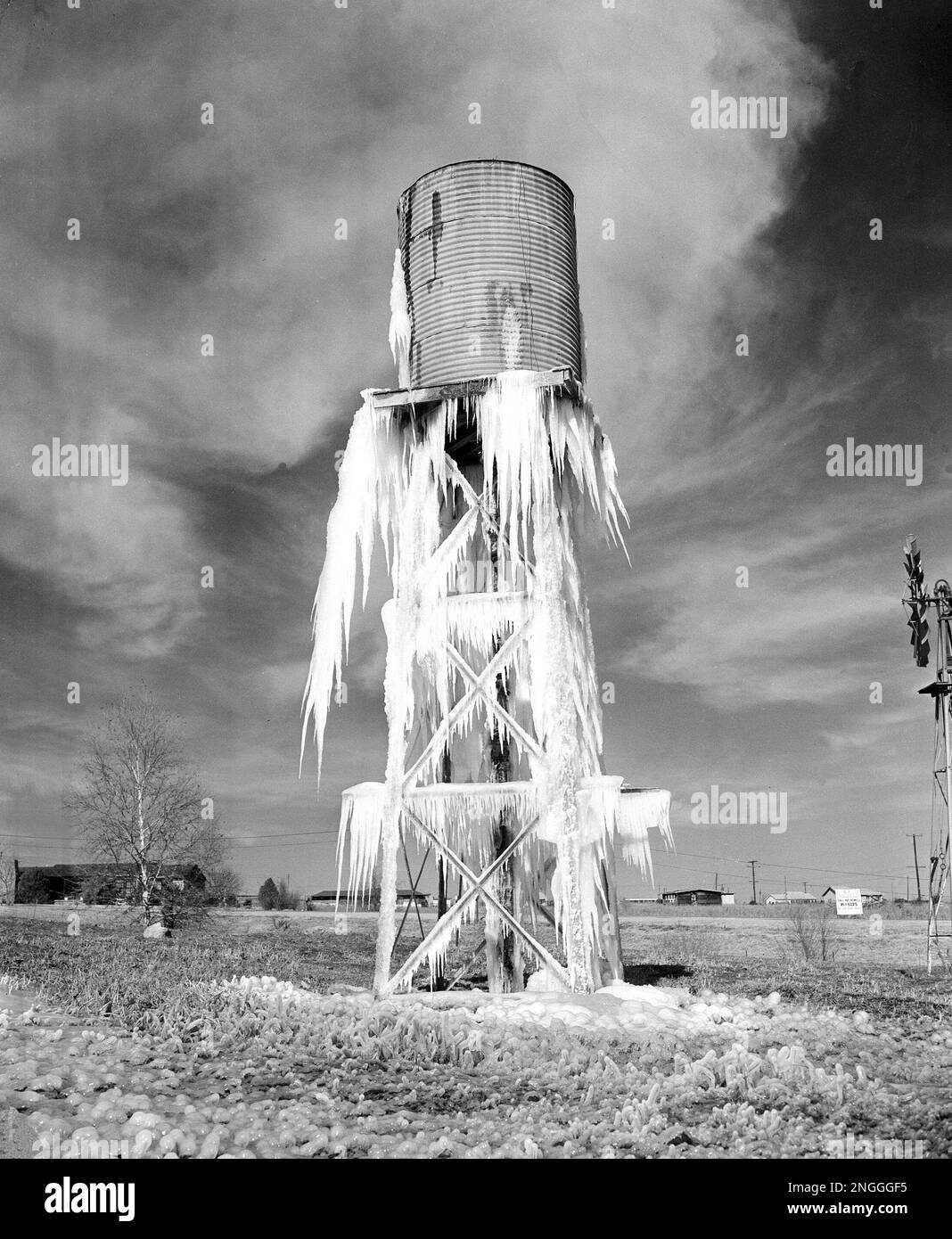 Dripping water from a windmill pump water tower is formed into ice