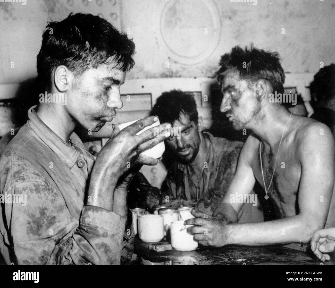 in this image provided by the U.S. Coast Guard, grimy and weary after two days and nights in the