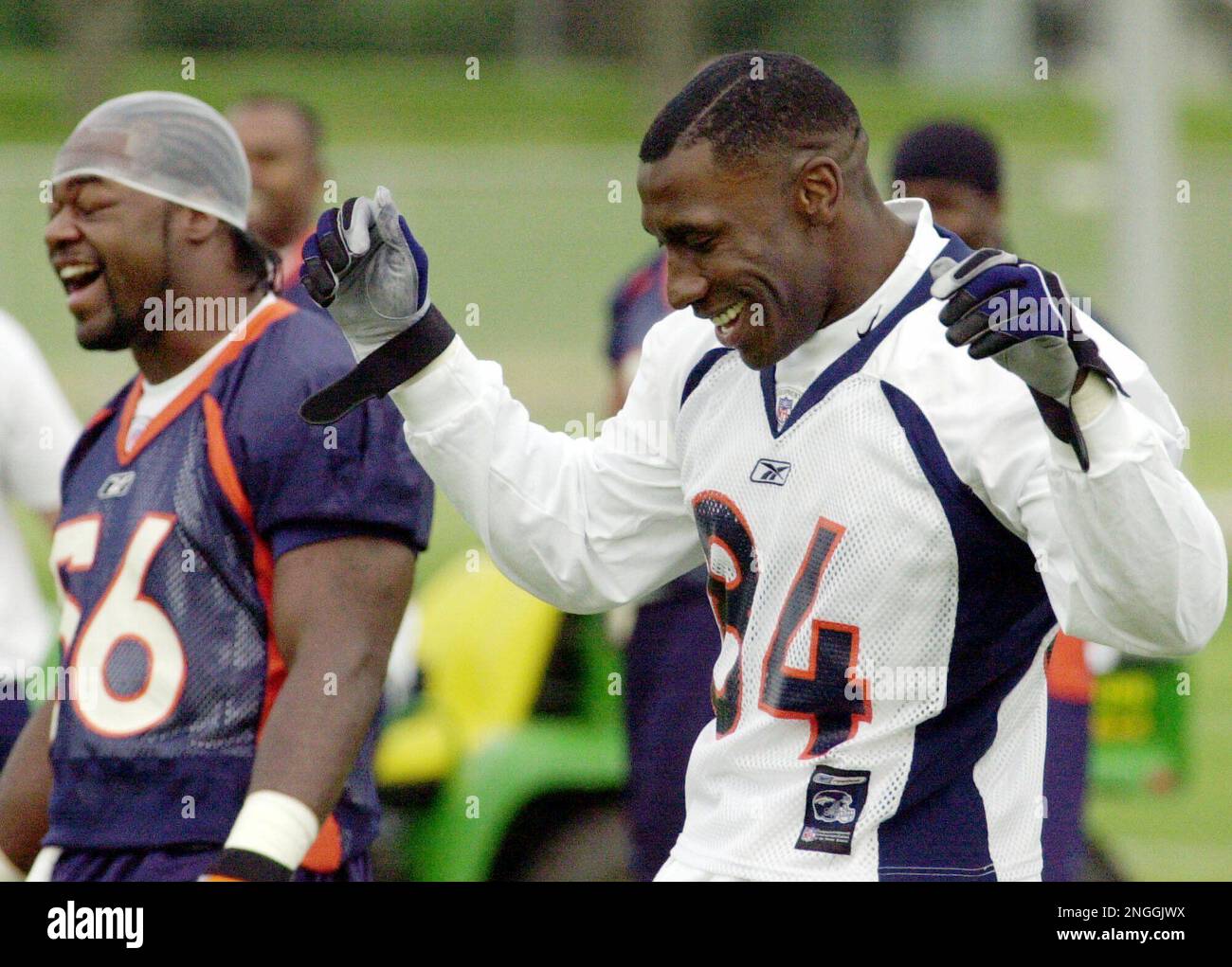 Denver Broncos linebacker Keith Burns jokes with teammates as the team  stretches before taking part in their first football practice following a  bye week for the Broncos in Denver on Monday, Oct.