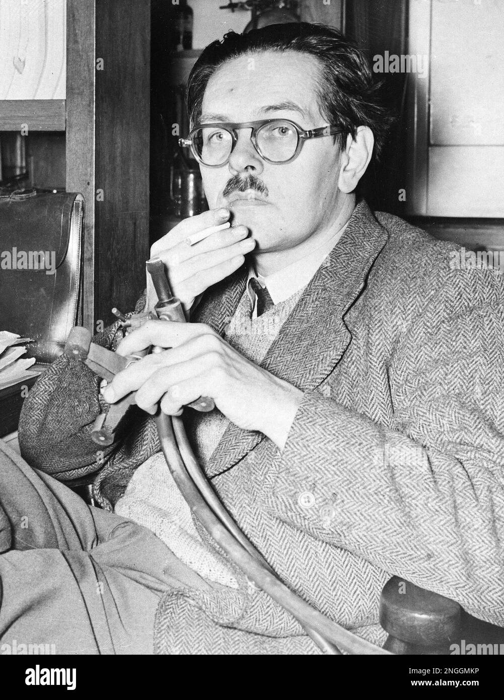 Dr Archer J P Martin Is Seen Sitting In His Laboratory At The dr-archer-j-p-martin-is-seen-sitting-in-his-laboratory-at-the