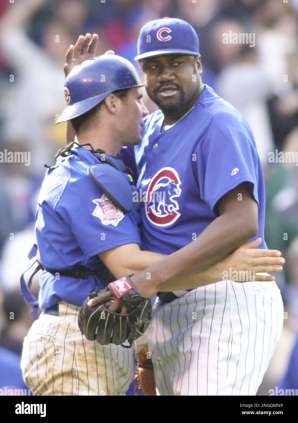 Chicago Cubs catcher Todd Hundley, left, and releif pitcher Antonio  Alfonseca celebrate the Cubs' 8-4
